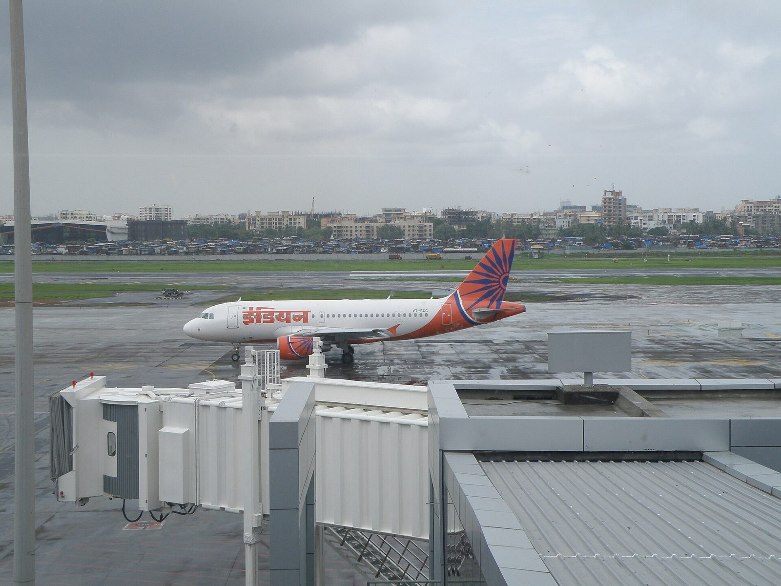An Air India aircraft parked outside a terminal at Mumbai airport