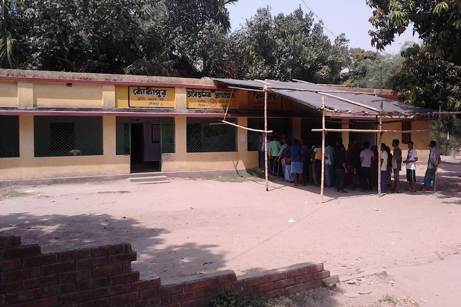 Voters queue at a polling station in Barasat, West Bengal