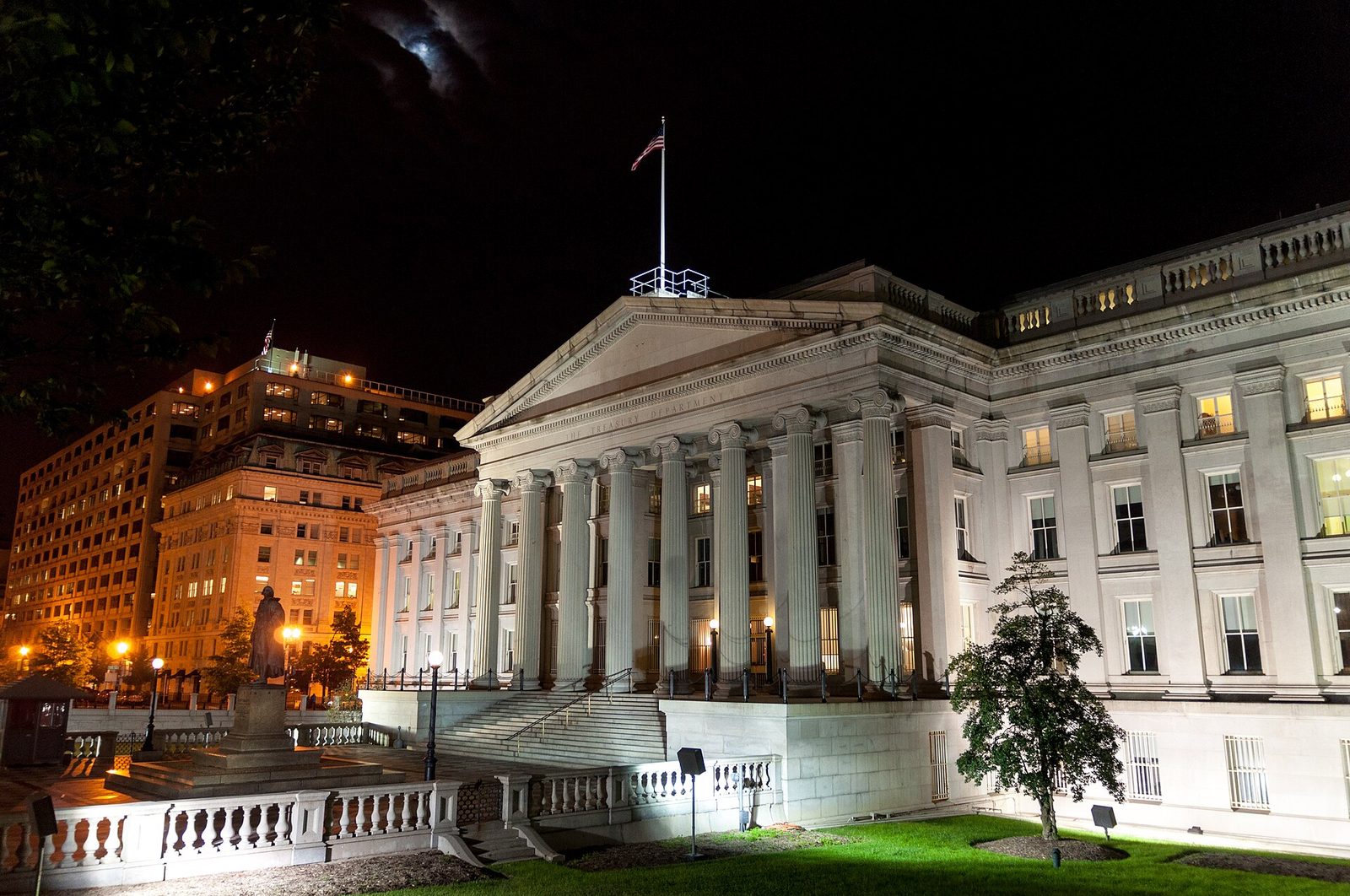 The US Treasury Department building in Washington, DC, lit at night