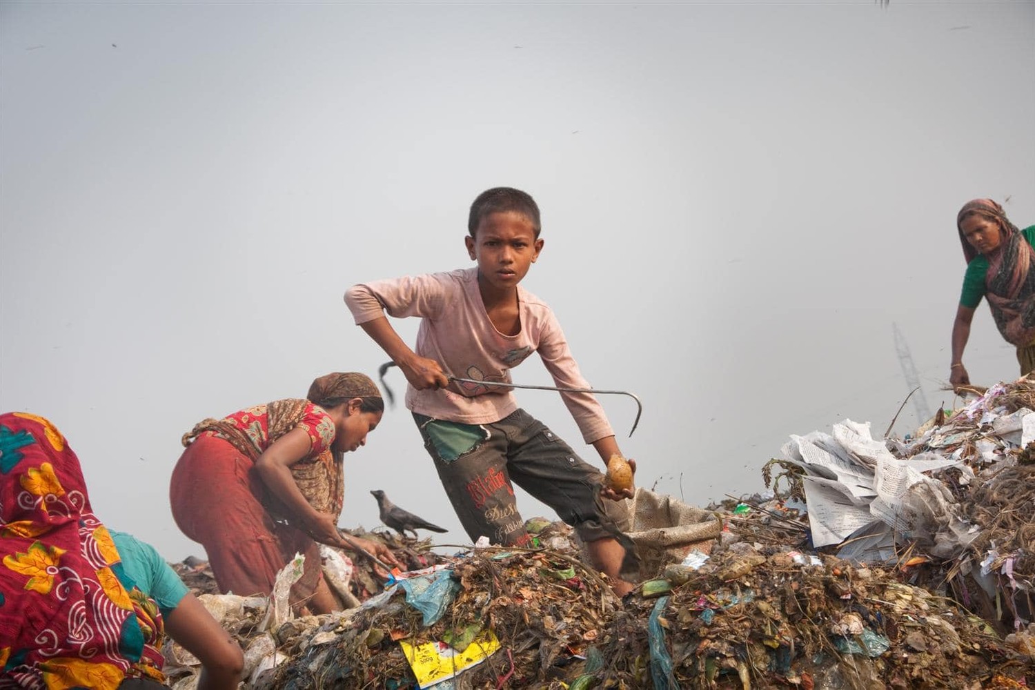 A child sorting material at a waste dump